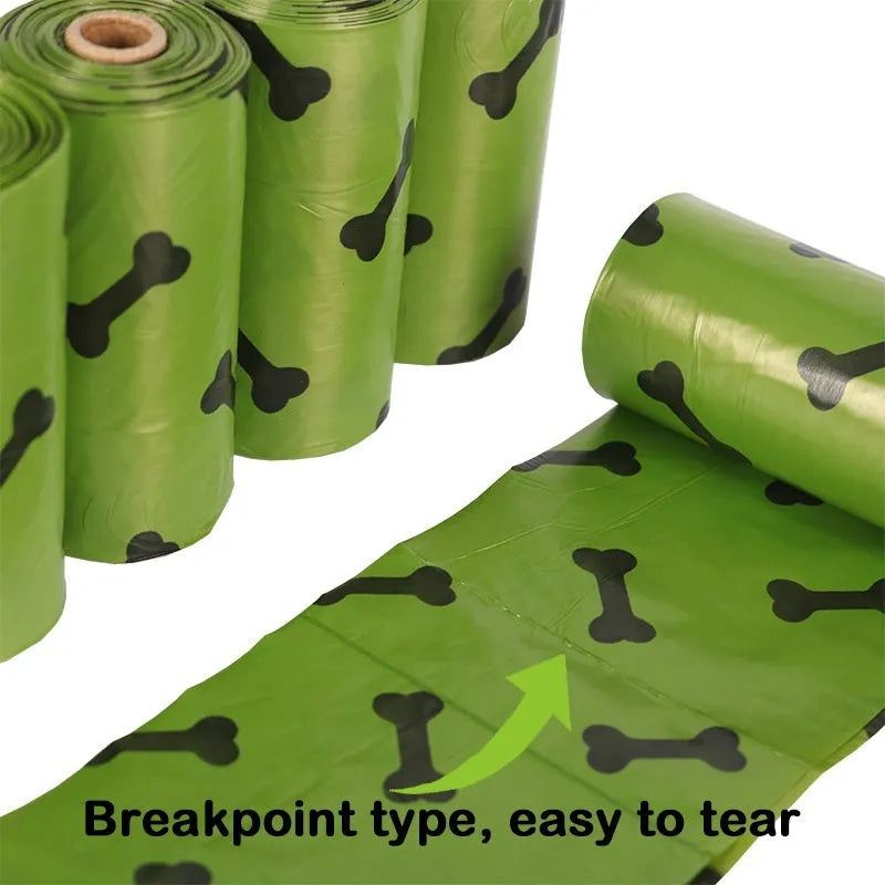 Roll of degradable military green dog poop bags with black bone print, showing bag size and dispenser option.