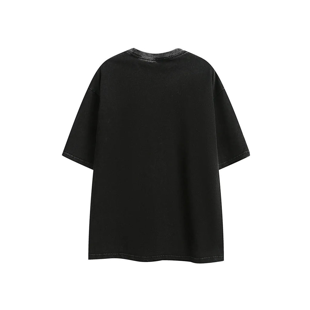 Loose retro-style short-sleeve cotton t-shirt with embroidered detailing in black or purple colour.