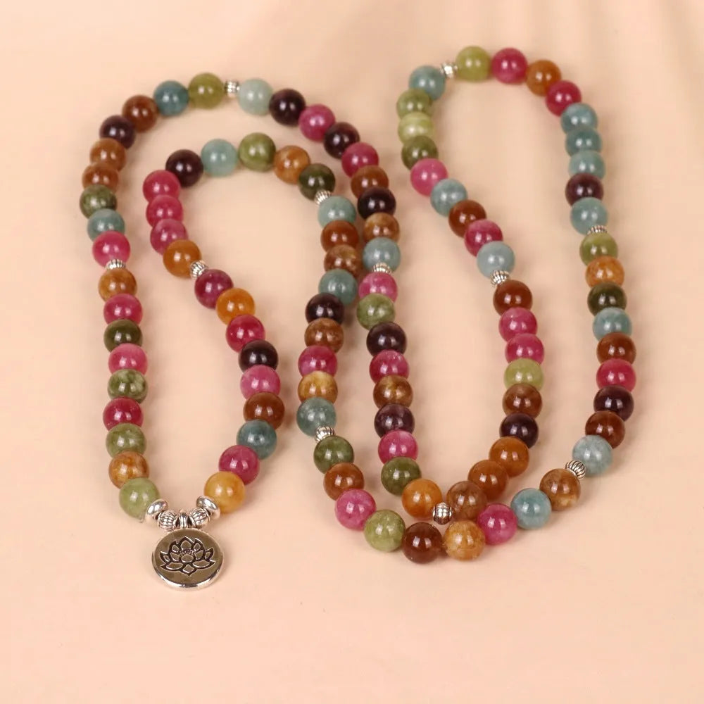 108-bead lotus hanging multi-layer bracelet in tourmaline colour on wrist