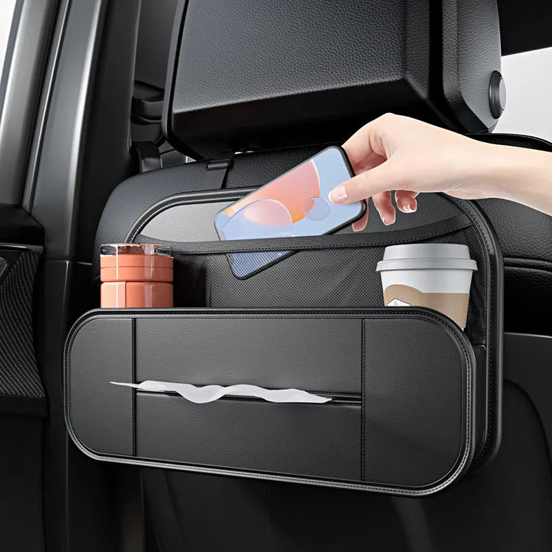 Black leather car seat back storage bag with mesh pockets for phones and bottles.
