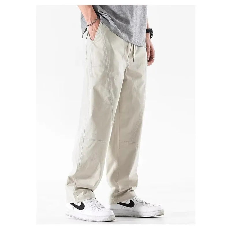 Cotton wide-leg trousers in milky white colour with a relaxed, straight-leg fit