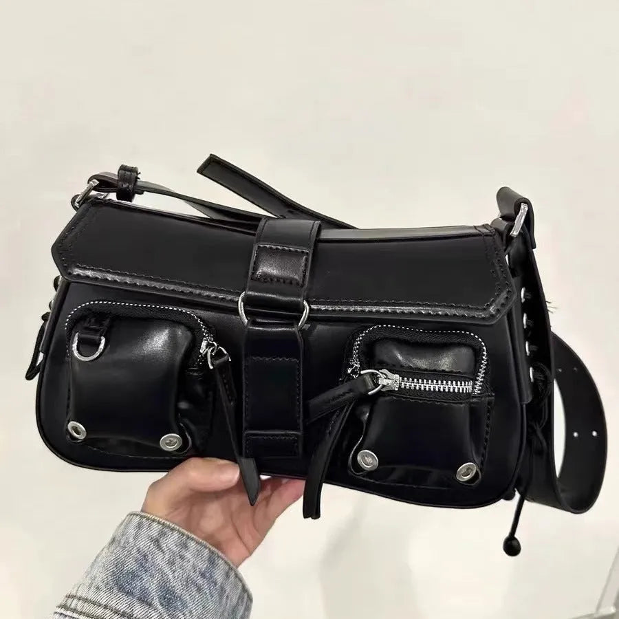 Black PU leather underarm baguette bag with an adjustable long strap.