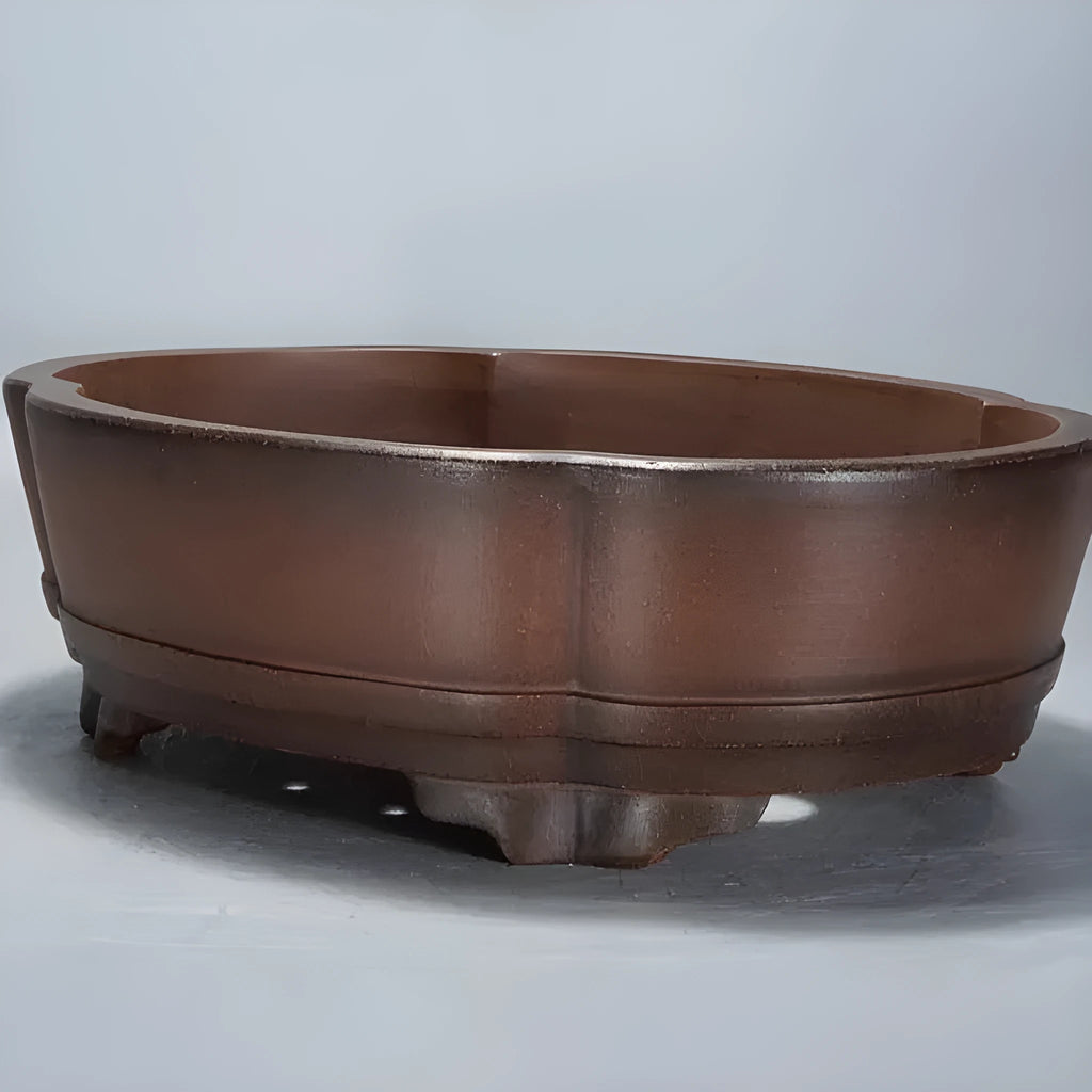Classical purple clay flower pot for plants, shown on a tabletop.