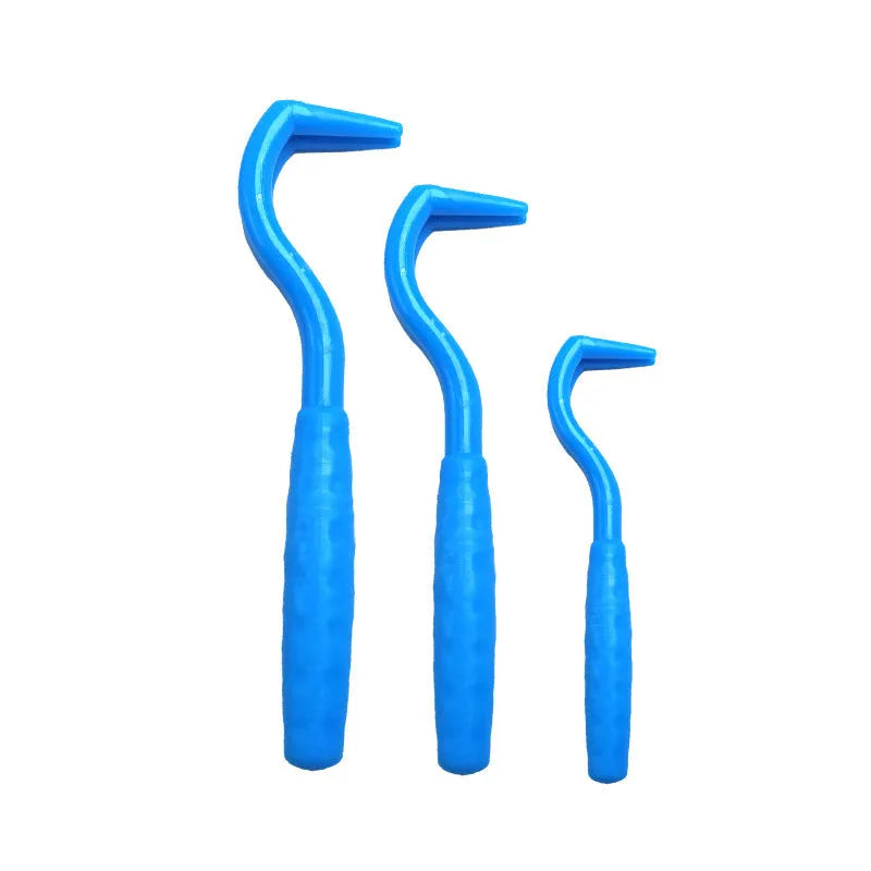 Set of three plastic tick removal hooks for dogs in various colours on a white background.