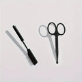 Black pet grooming brush with soft bristles for eye tear stain removal and comb attachment for dogs and cats