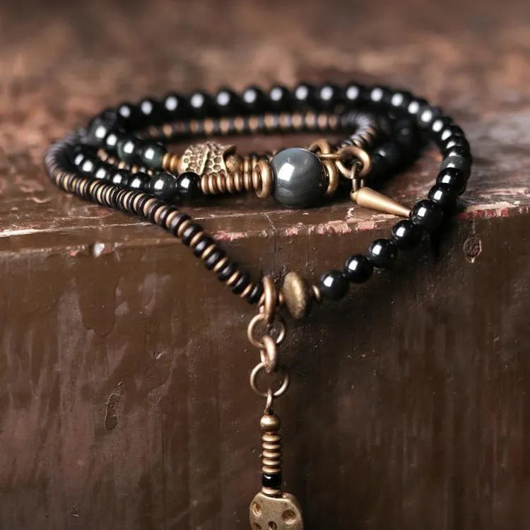 Geometric black stone beaded bracelet with multi-layered retro design