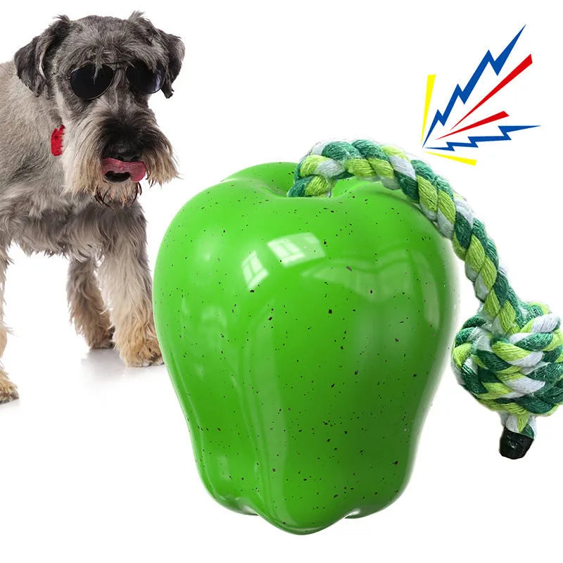 Green apple-shaped plastic dog toy with food dropping ball for interactive feeding and dental chewing