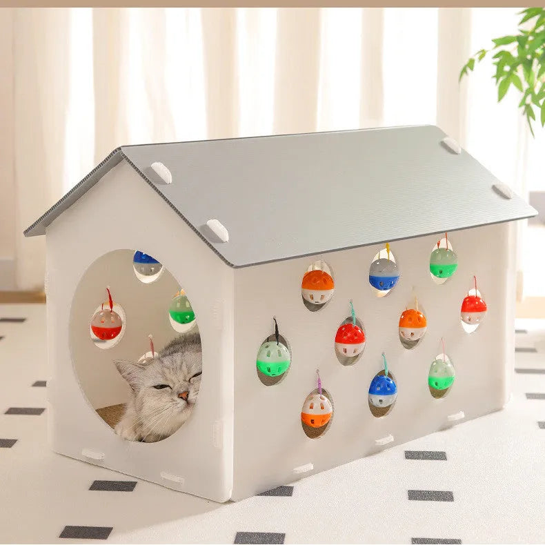Plastic cat scratch board integrated with tunnel and nest containing bell ball
