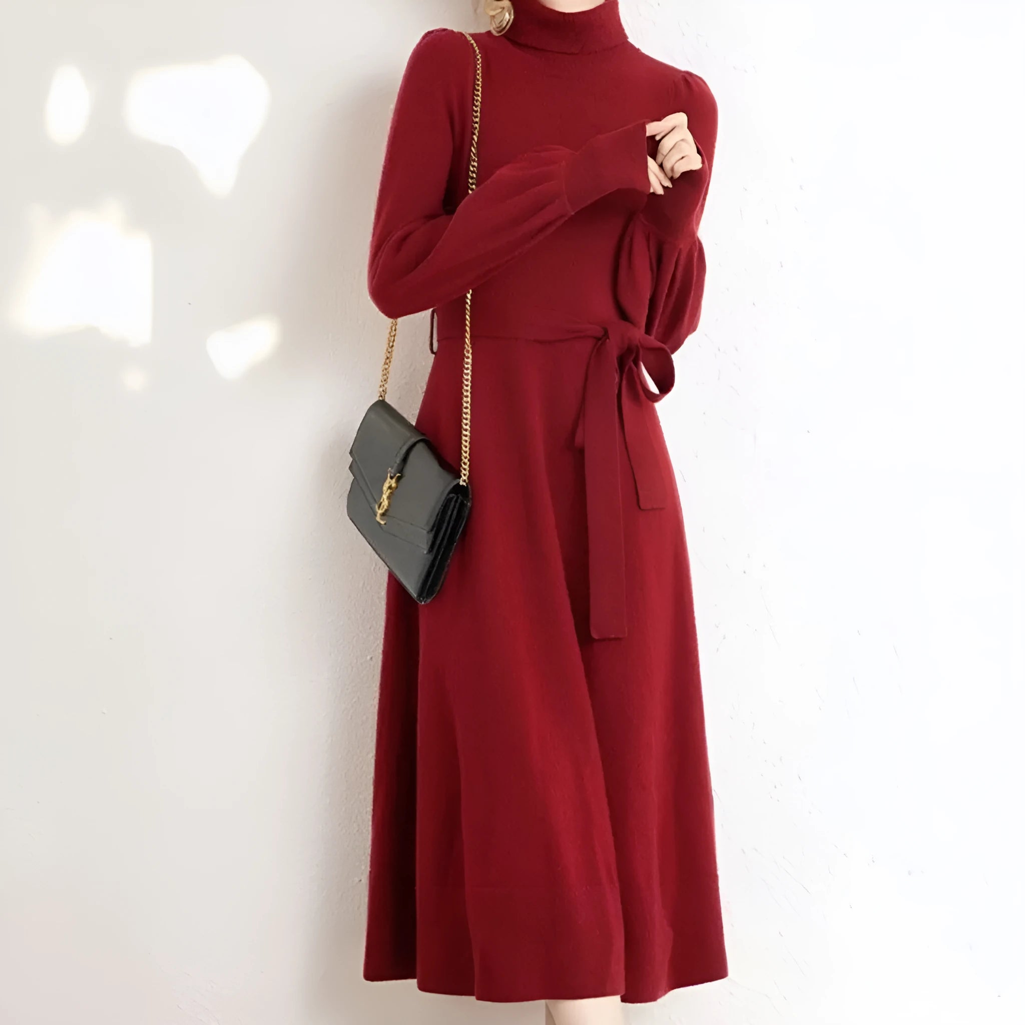 Rose red knitted turtleneck pullover dress with long sleeves and a loose, mid-length skirt with an elasticated waist.