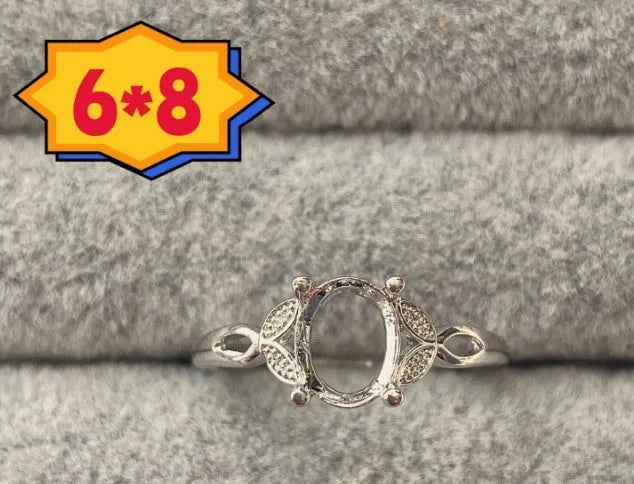Oval denier ring with open mouth design, 6x8mm main stone and five-pointed star decoration