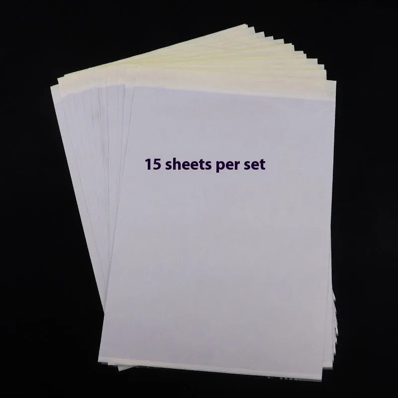 Stack of A4 tattoo transfer paper sheets with clear quadruple lines and transfer gel tube