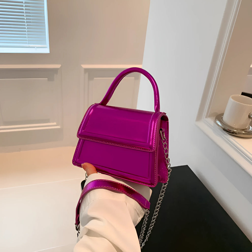 PU material crossbody shoulder bag in a horizontal square shape with visible sewing line details.