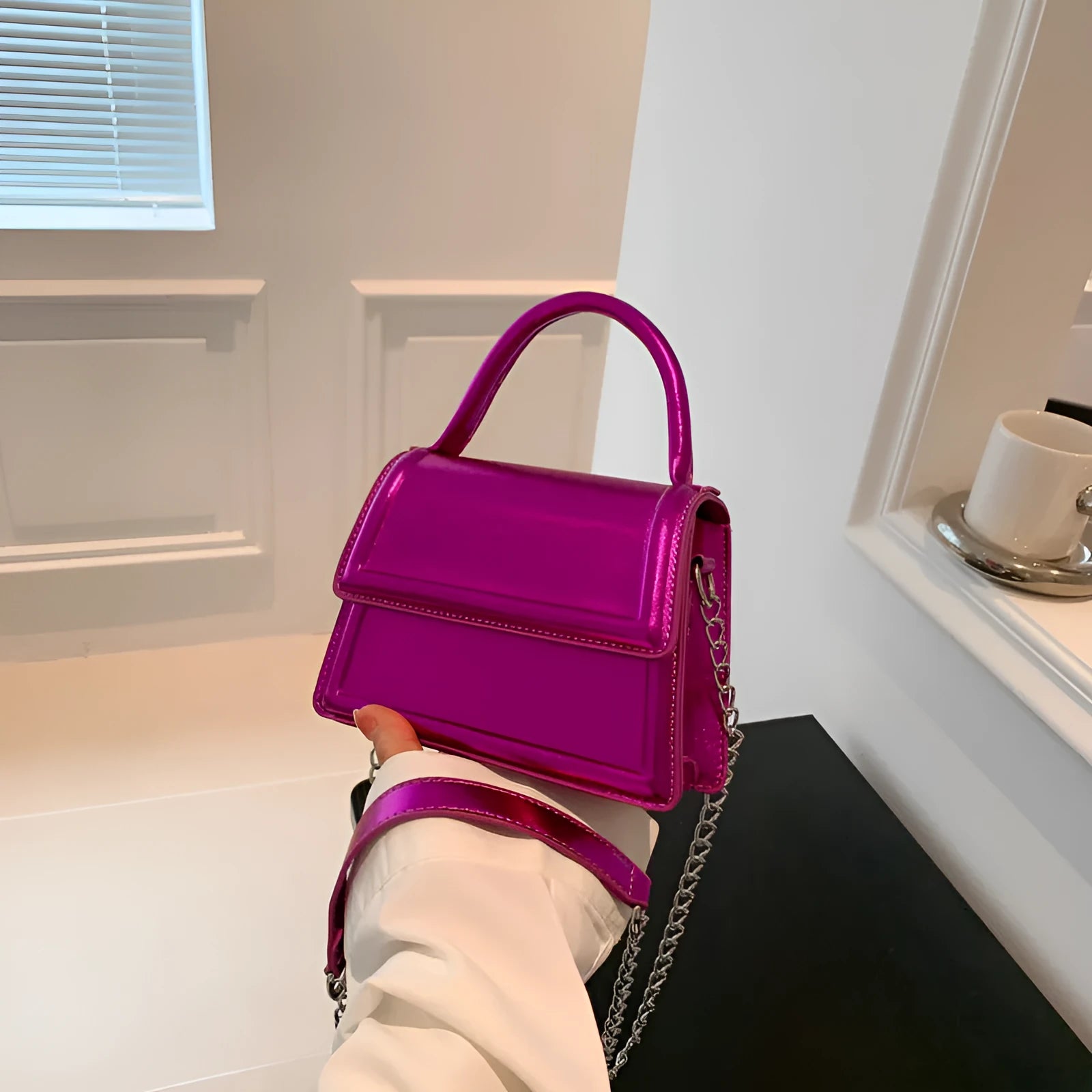 PU material crossbody shoulder bag in a horizontal square shape with visible sewing line details.