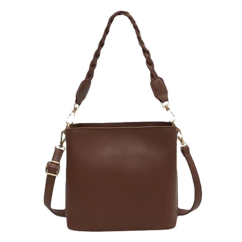 Retro woven PU leather crossbody bucket bag in khaki colour showing bucket shape and shoulder strap