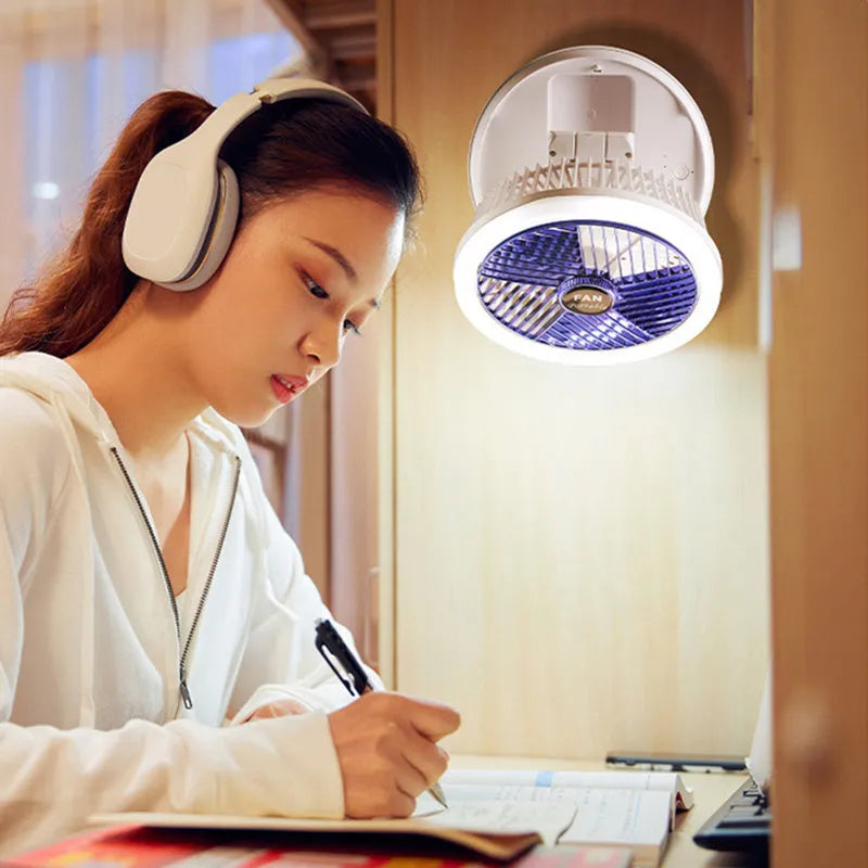 Blue foldable USB desk fan with LED light showing wall mounting bracket and pen holder