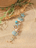 Close-up of a women's alloy starfish rhinestone bracelet in turquoise colour.