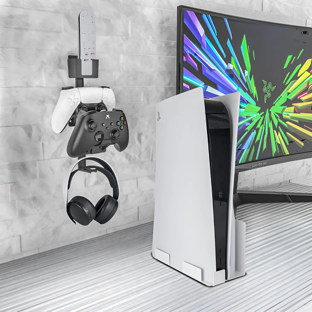 White adhesive wall hook holding a game controller and headphones