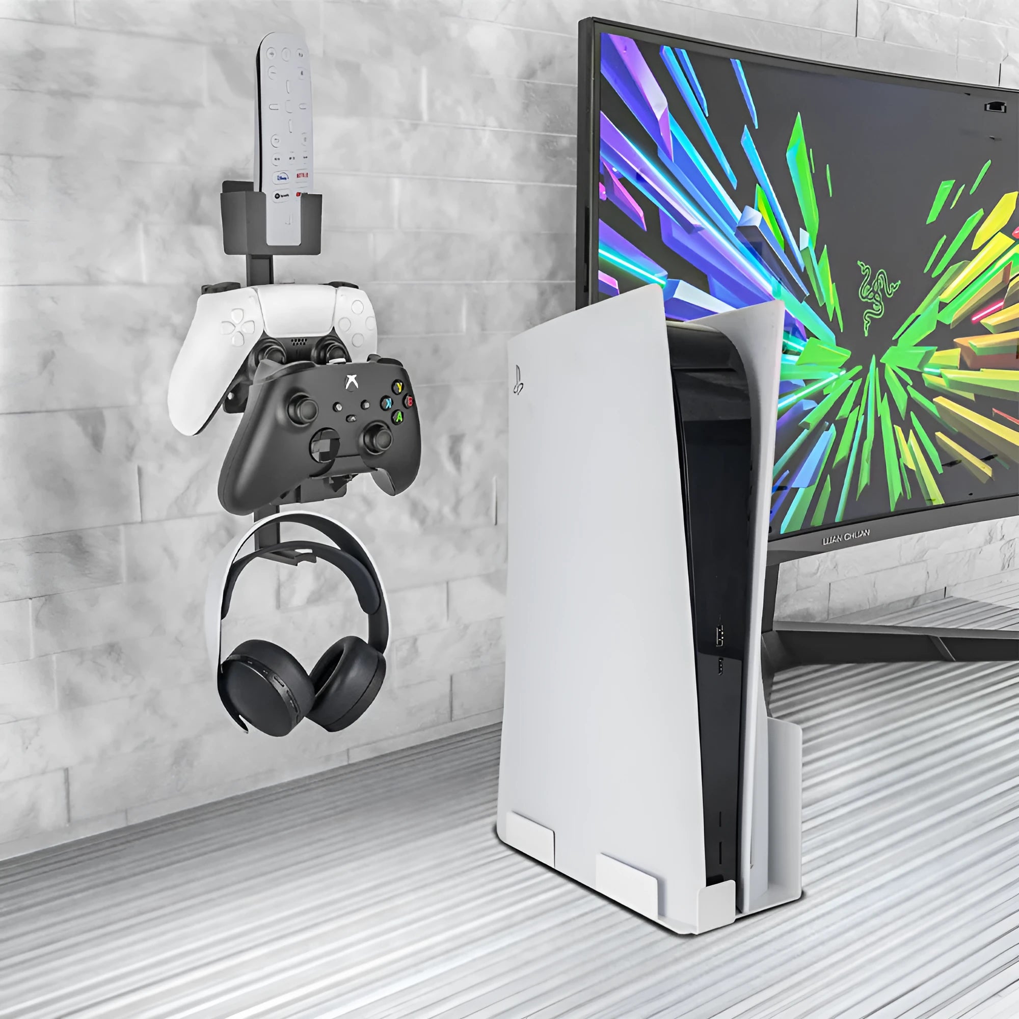 White adhesive wall hook holding a game controller and headphones