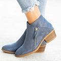 Women's blue suede ankle boots with side zip and chunky heel on a white background