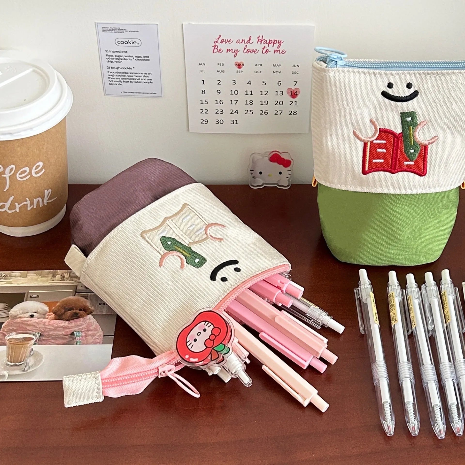Brown Korean style cartoon print collapsible pencil case with zipper, lying flat.