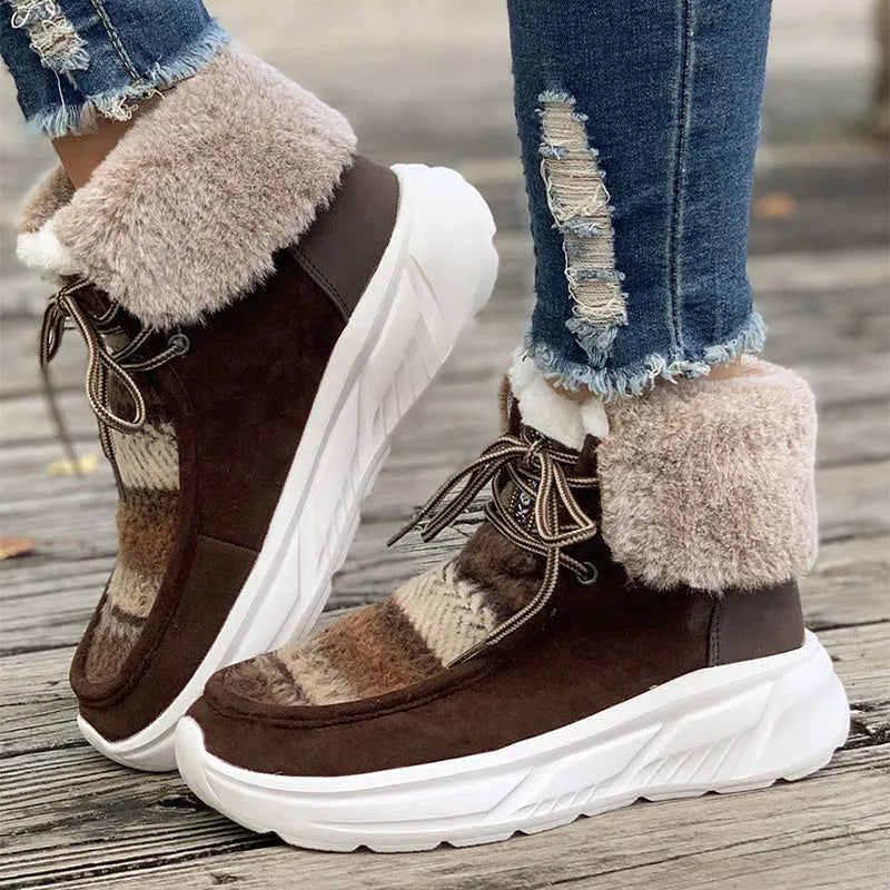 Beige women's lace-up snow boots with a suede upper, thick rubber sole, and plush lining.
