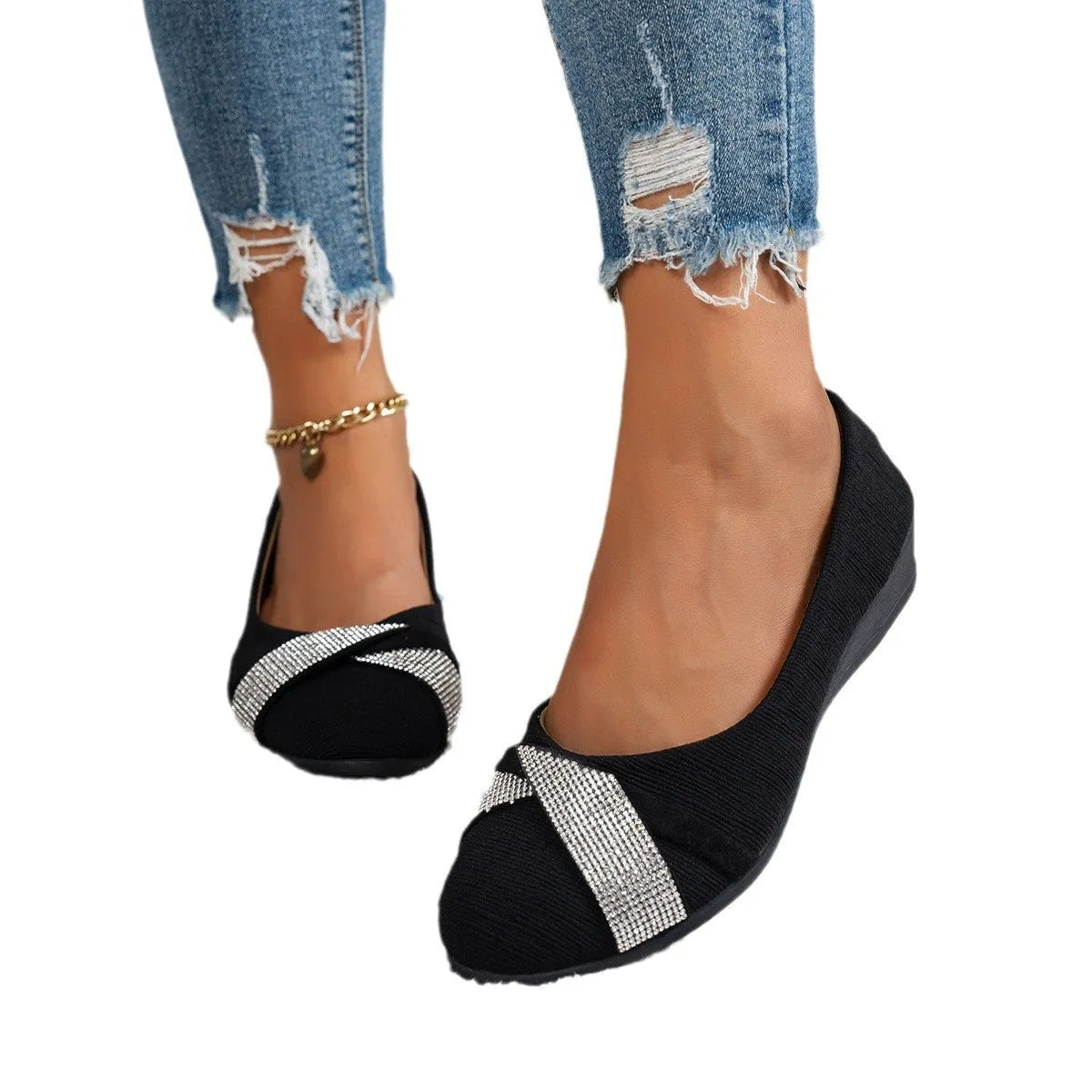 Black women's slip-on casual shoes with rhinestones on the toe and a chunky heel.