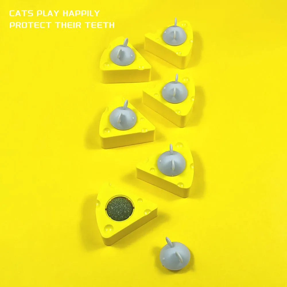 Yellow natural catnip chew toy balls for cats on a plain background.