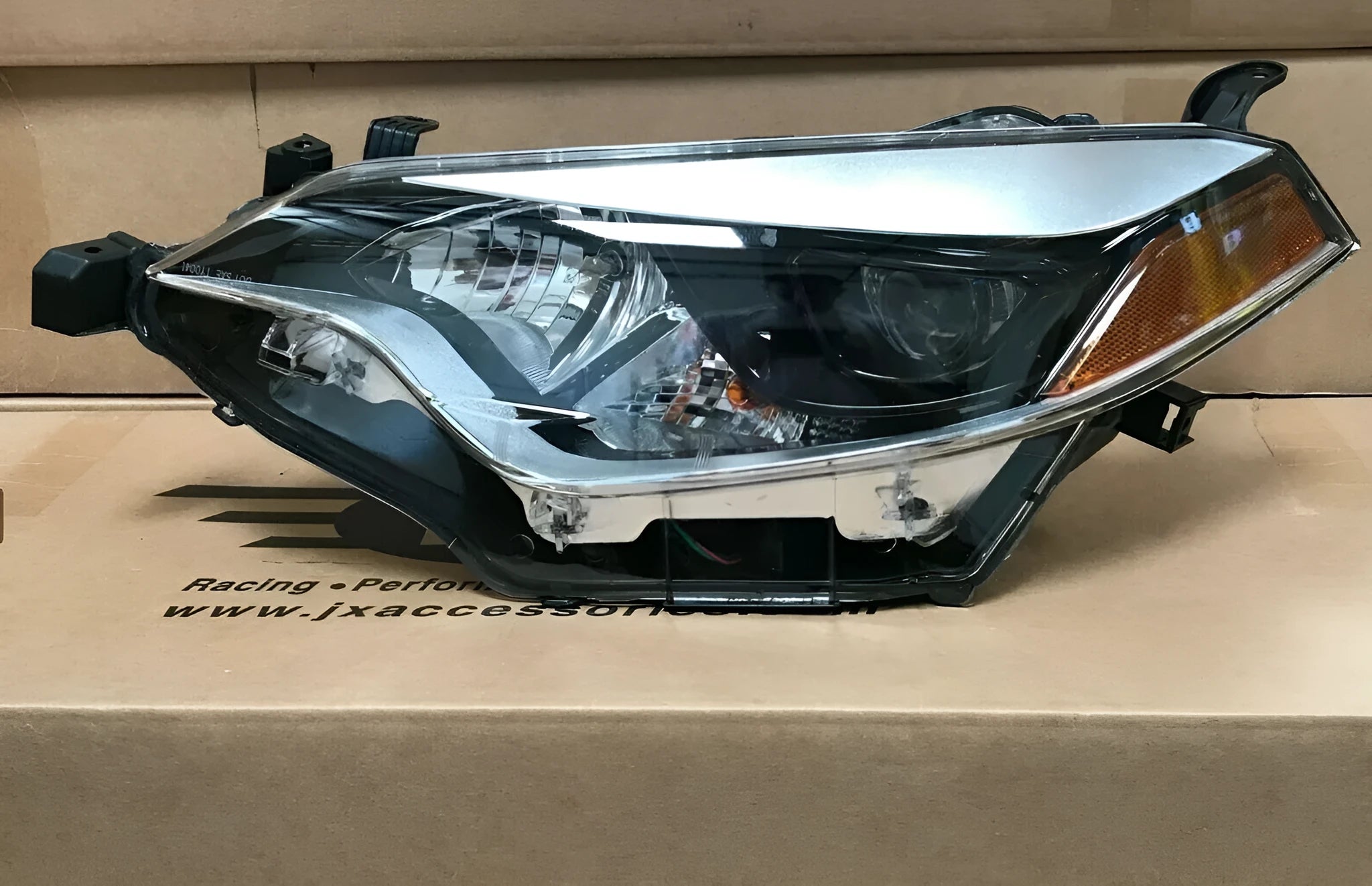 Halogen headlight assembly for passenger side of 2014-2016 Toyota Corolla.