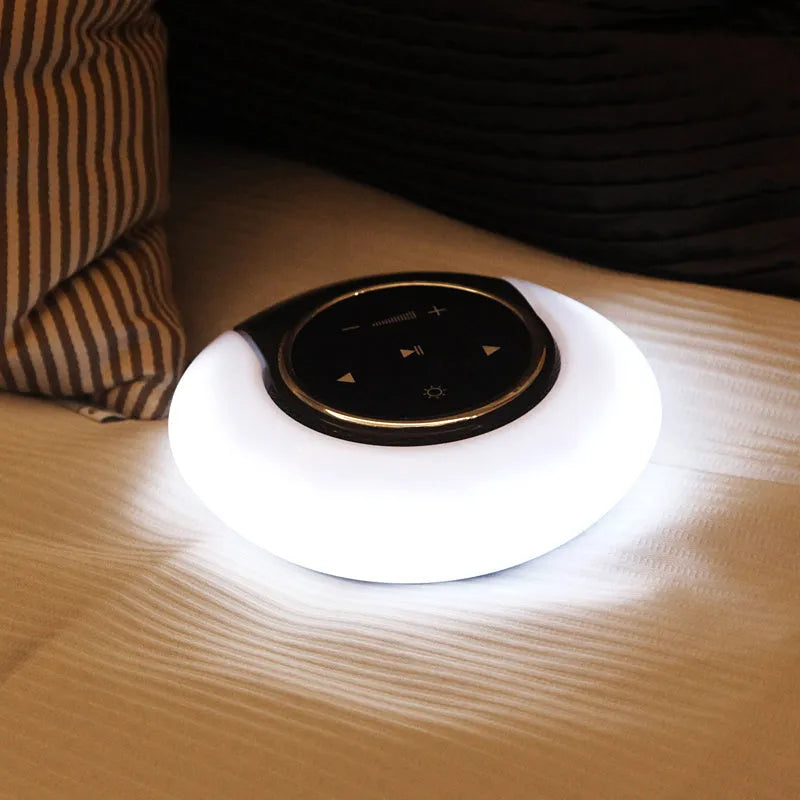 Blue folding Bluetooth desk lamp speaker with subwoofer and touch controls for adjustable LED lighting.