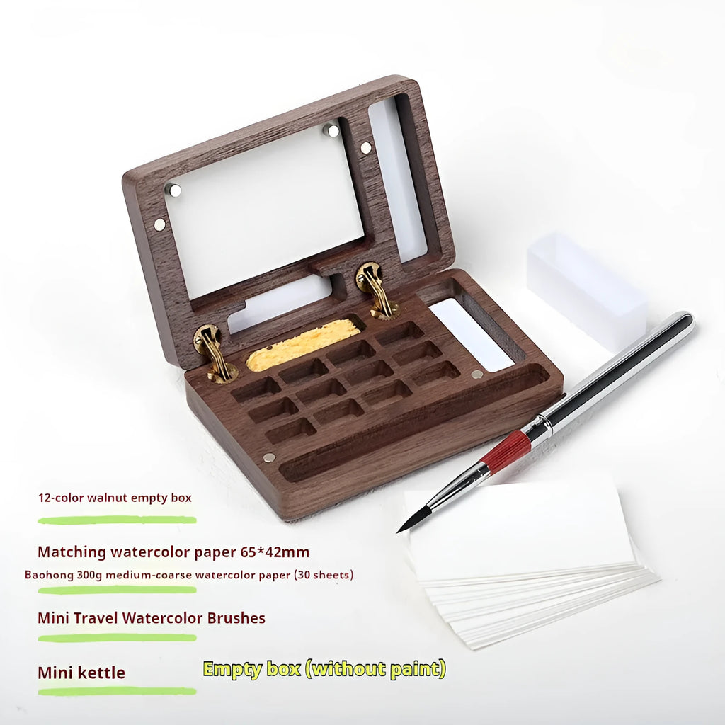 Mini walnut wood watercolour paint box open to show pigment suit selection