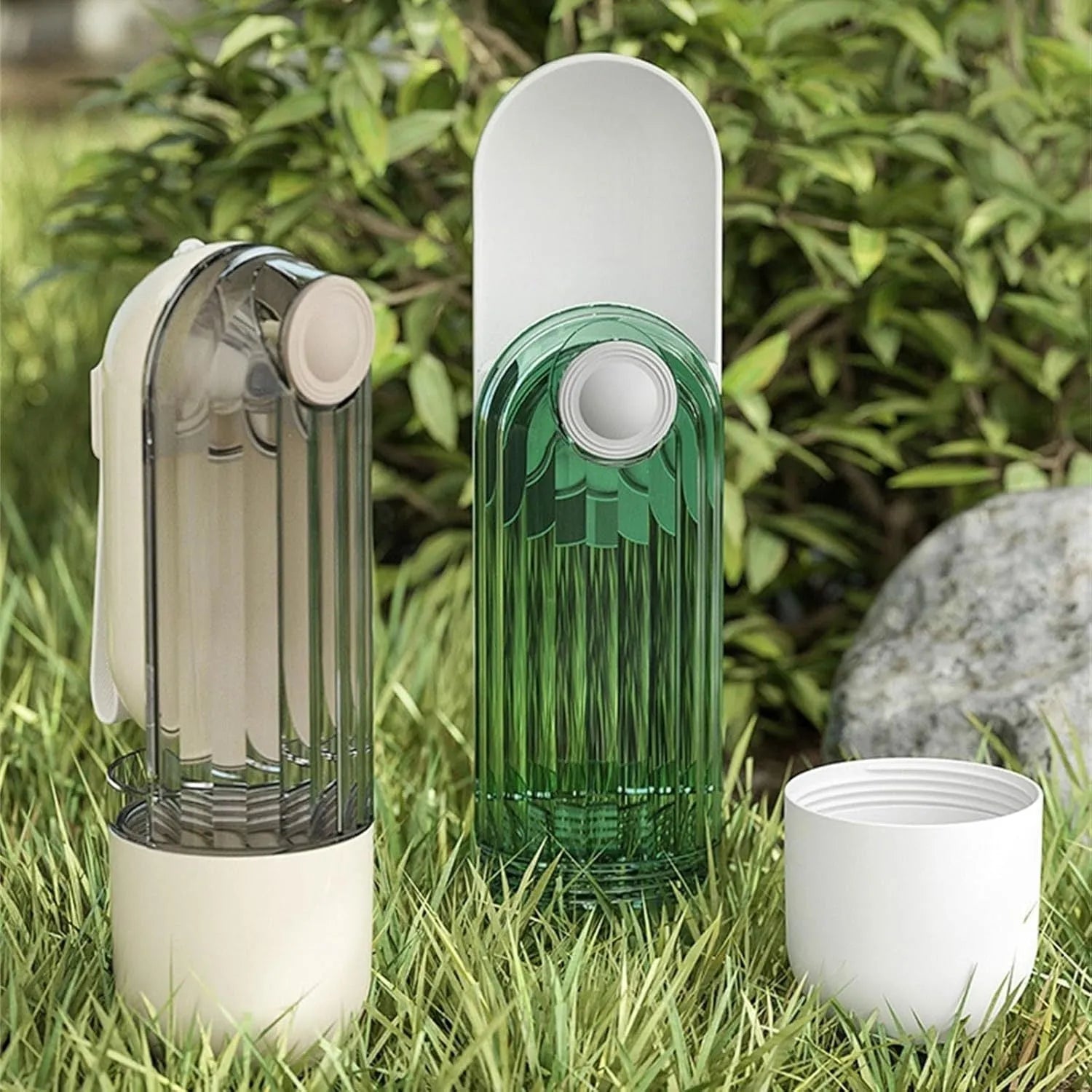 Beige and green foldable dog water bottle with food dispenser shown collapsed and open.