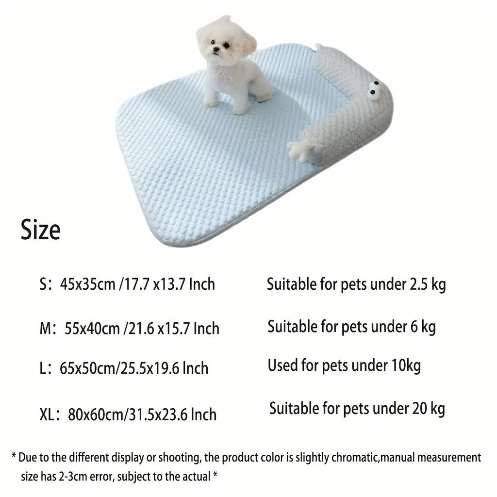 Blue pet cooling mat with big-eyed monster print on a wooden floor