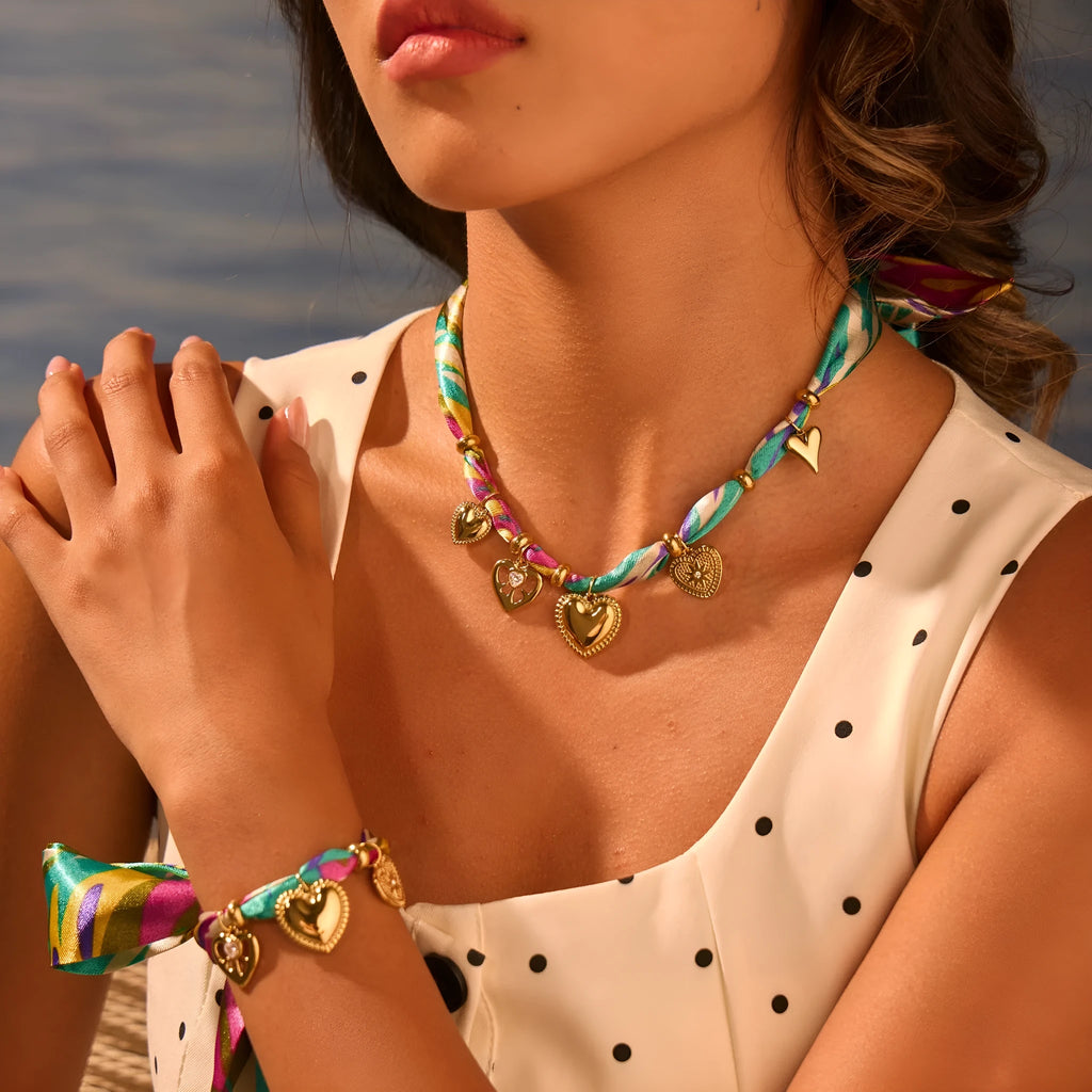 Women's stainless steel geometric pendant necklace and bracelet set with 18K gold plating and adjustable chain