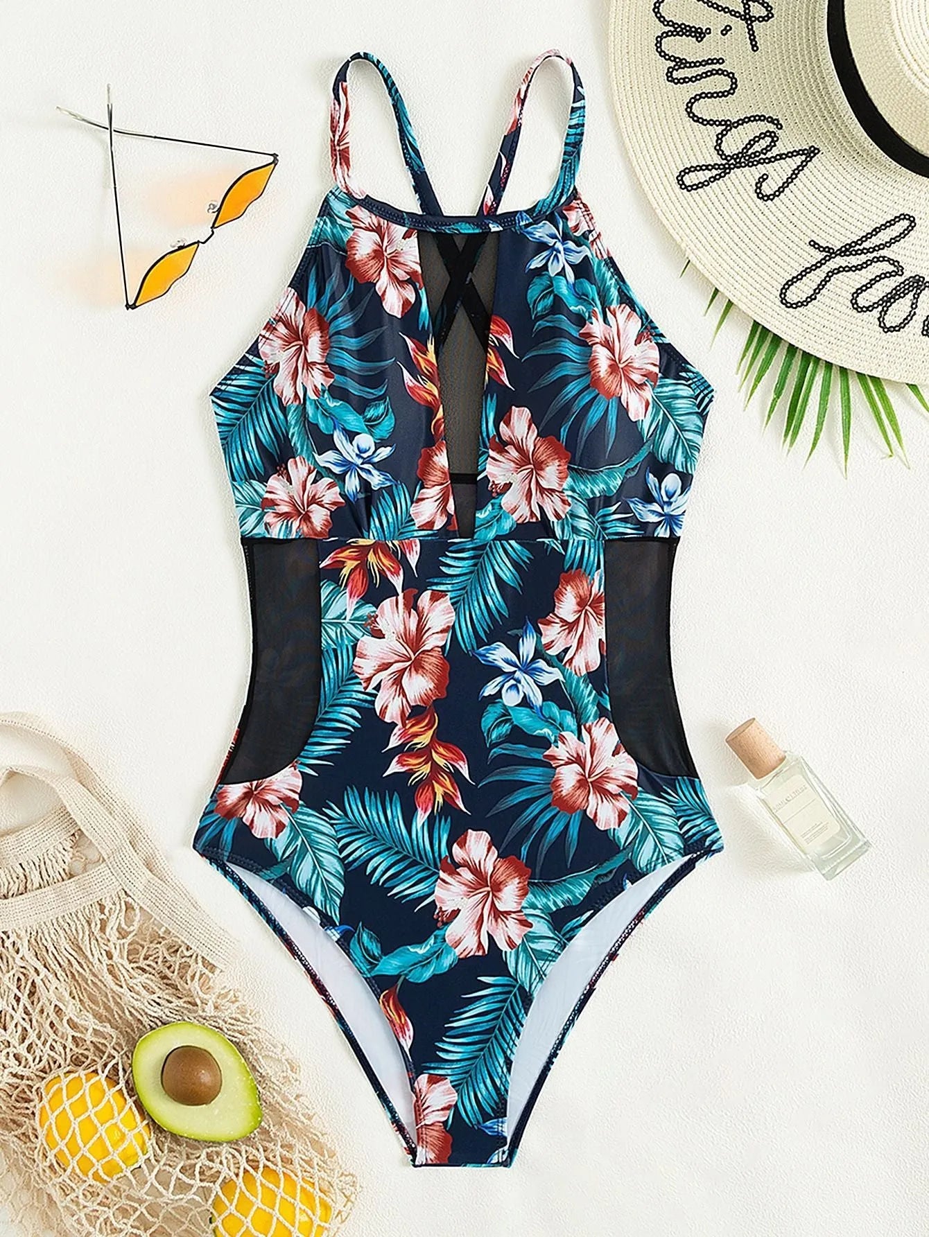 Women's deep V-neck one-piece swimsuit in a solid colour on a mannequin.