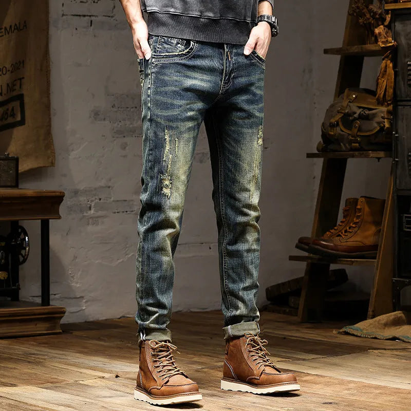 Man wearing retro blue skinny fit stretch denim jeans with a zip fly.