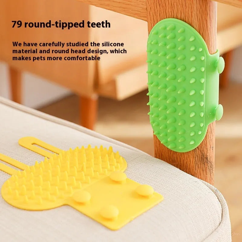 Silicone cat grooming comb with adjustable strap mounted on table leg, showing rounded teeth for pet hair removal