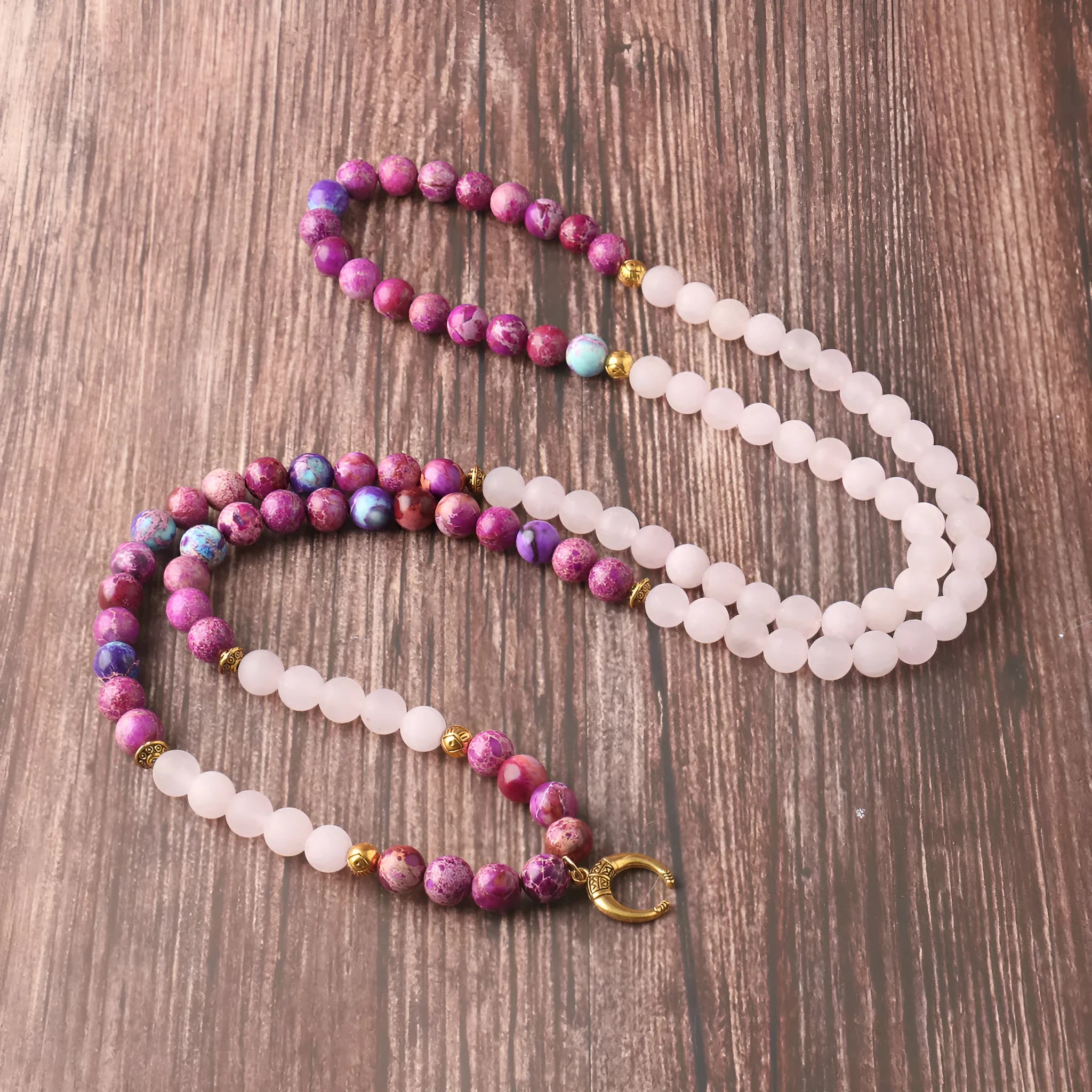 Round Emperor Stone necklace pendant with pink crystal detailing on chain