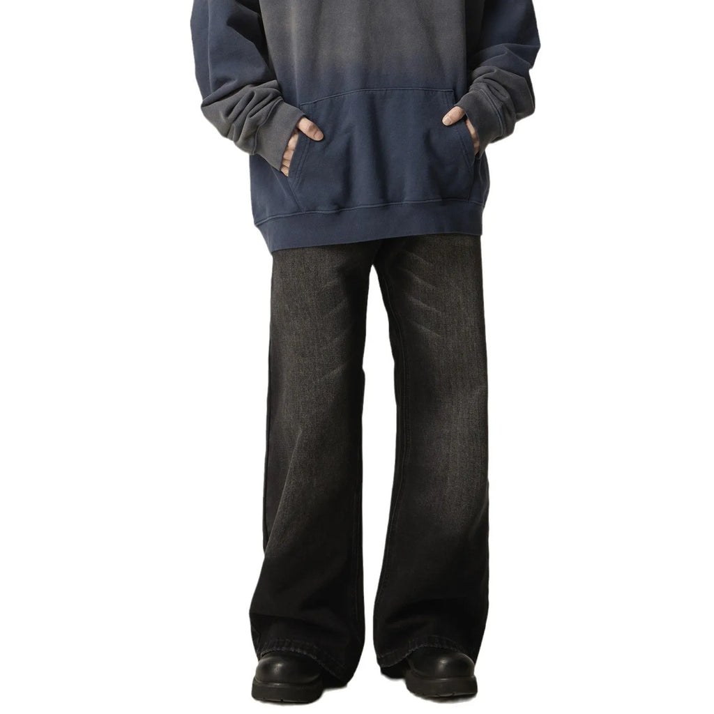 Black loose-fit straight-leg retro jeans with a zip fly on a neutral background.