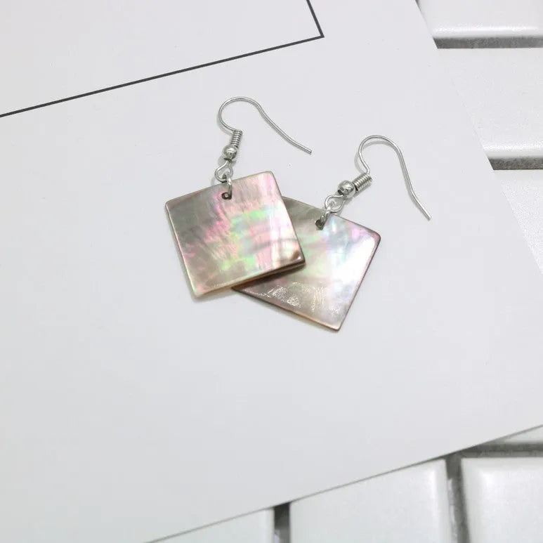 Women's geometric shell earrings in rectangular and square panther natural colours