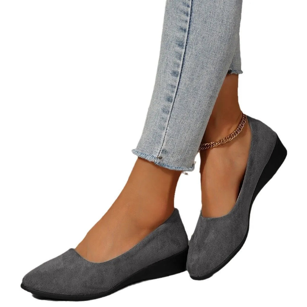 Women's plus size suede wedge pumps in light brown with a low rubber heel and round toe.