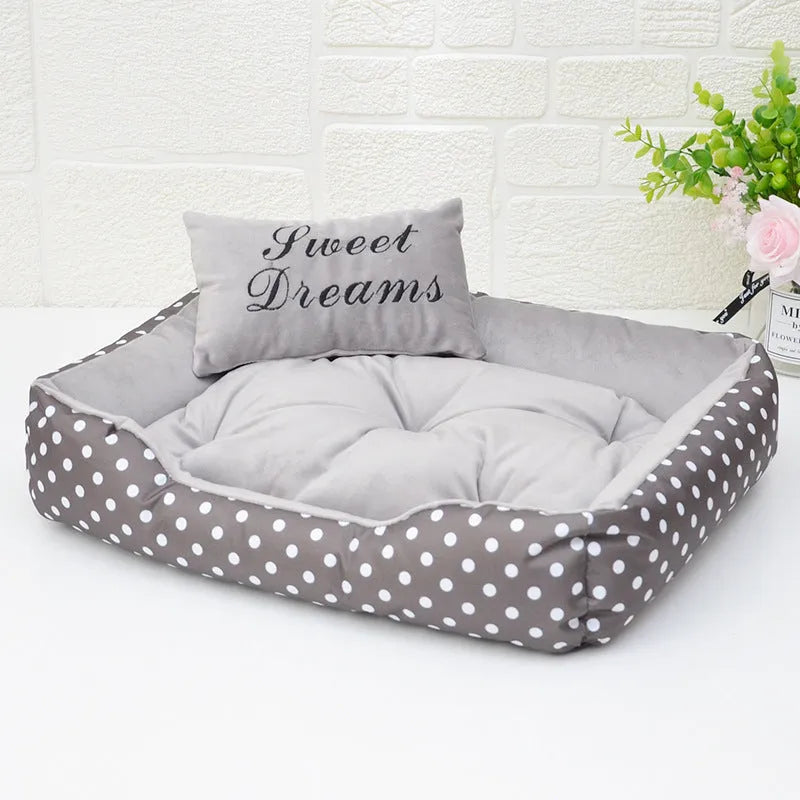 Polka dot print square dog bed with a matching embroidered pillow in grey, blue, pink, or red.