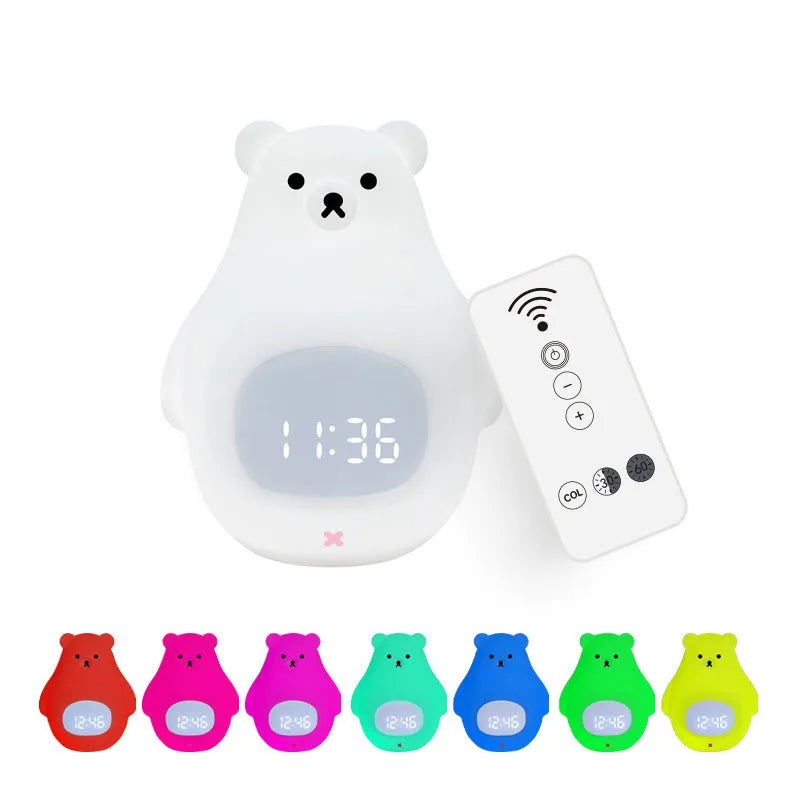 White bear-shaped silicone night light with remote control on a table.