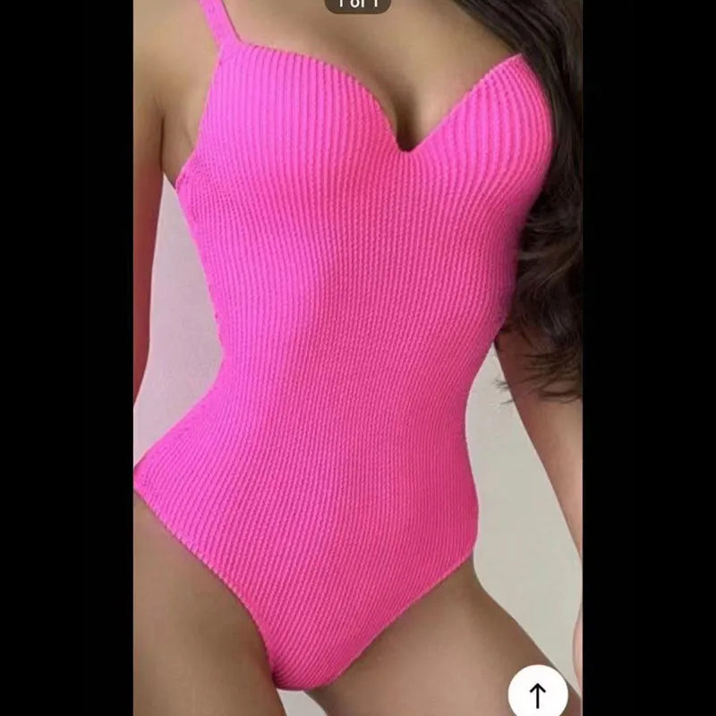 Women's black one-piece swimsuit with a sunken white stripe pattern across the front, sleeveless design.