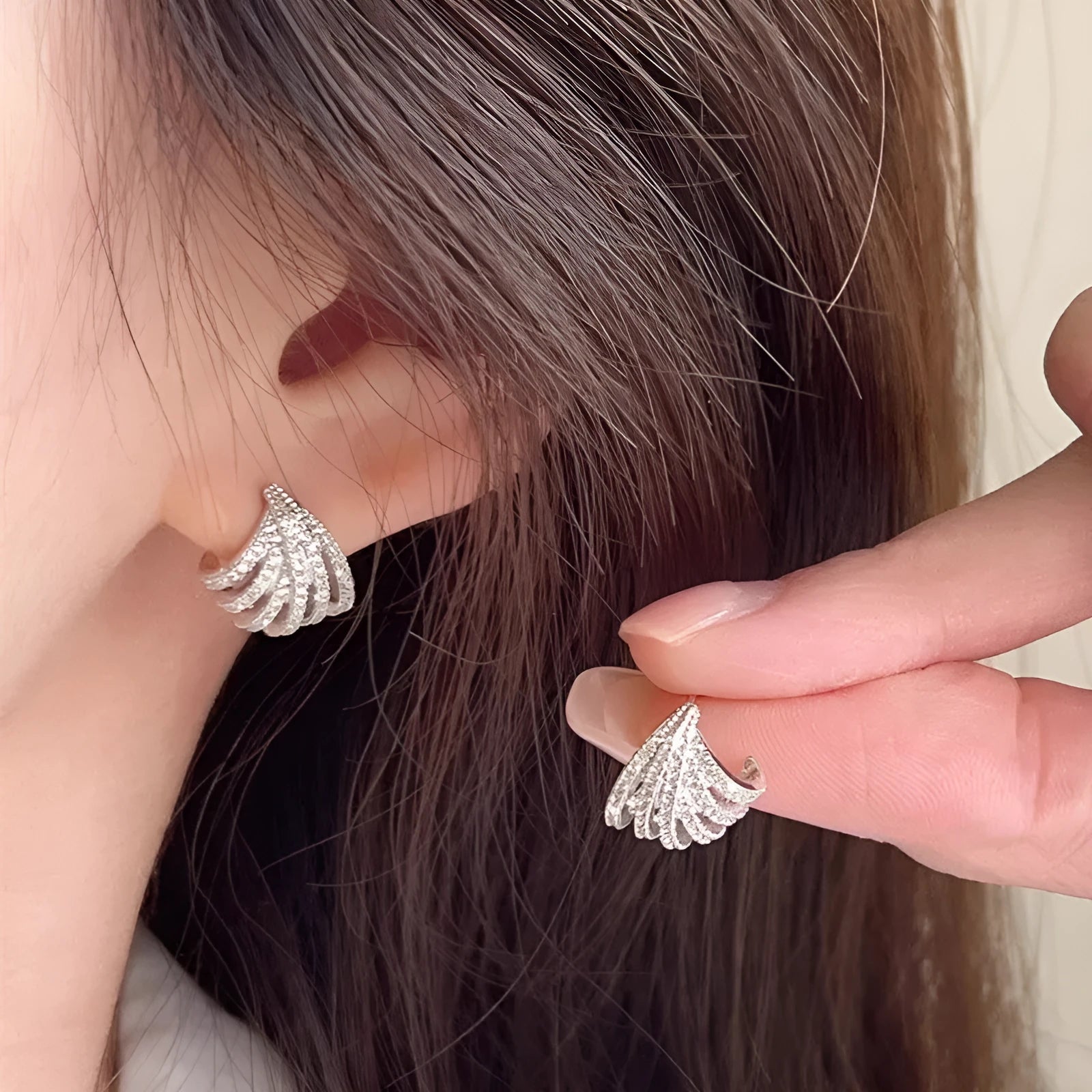 Pair of women's geometric linear earrings with a platinum electroplated finish