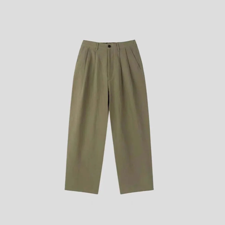 Men's loose lightweight cotton linen trousers in apricot colour showing wide-leg Korean style design