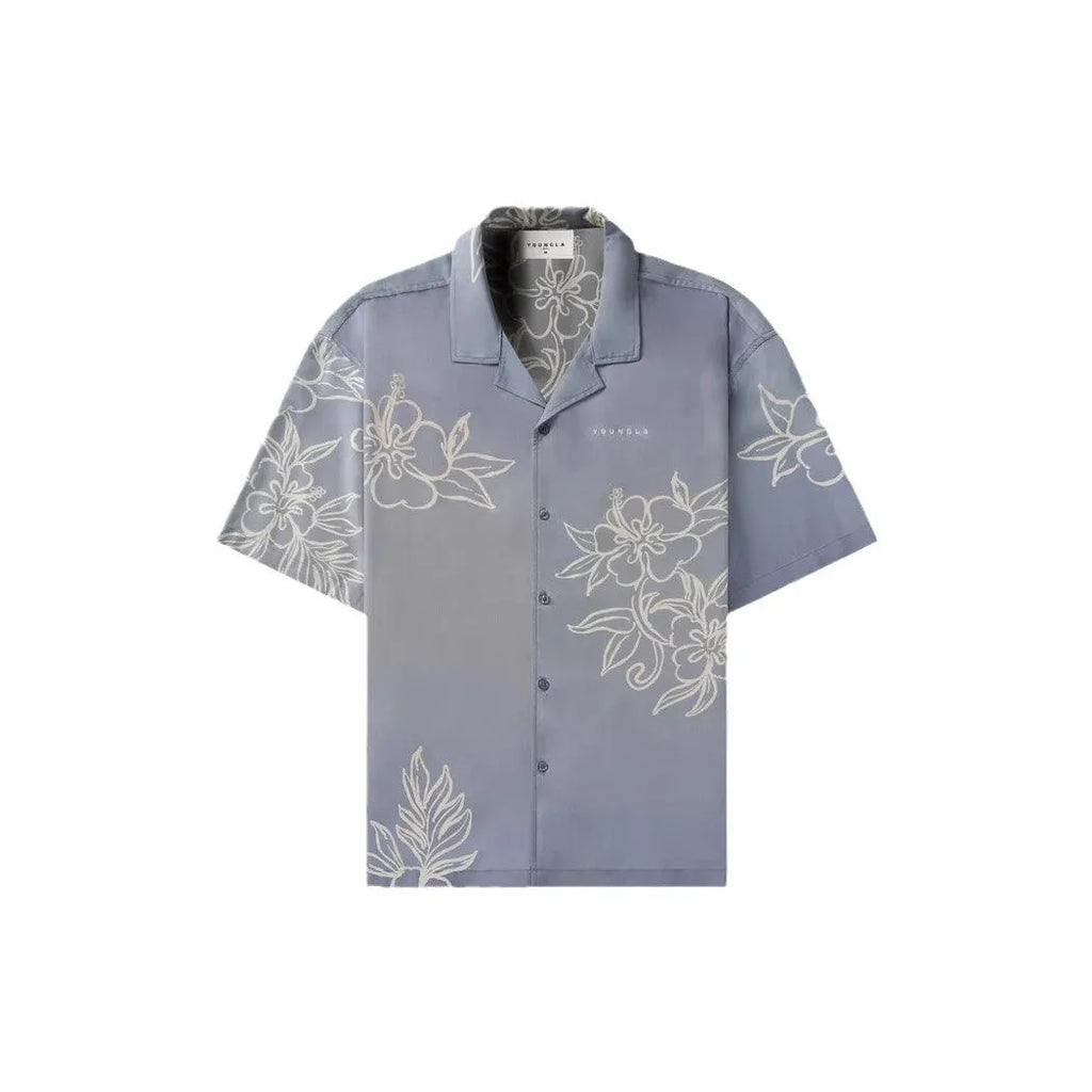 A man's loose-fitting, short-sleeve casual top with a floral print, shown in a neutral colour.