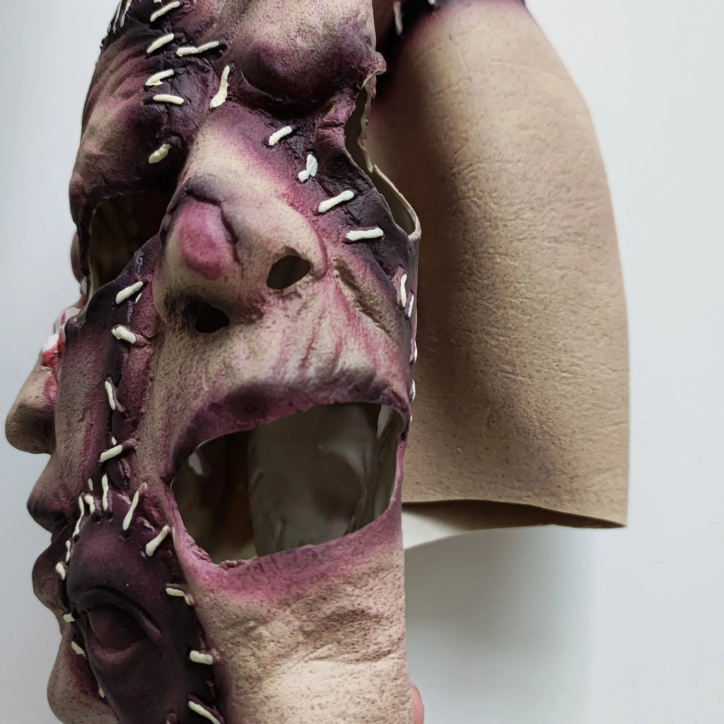 Halloween three-sided grimace horror mask in natural latex showing realistic facial effect