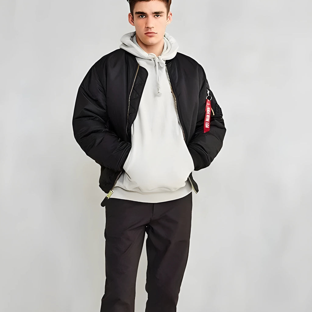 Men's loose-fit army green nylon pilot jacket on a hanger