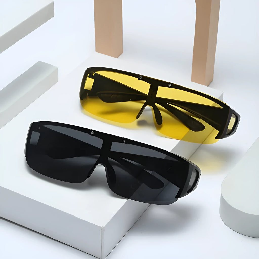 A pair of polarised sunglasses for myopia with one-piece lenses, shown in a colour option like black or green.