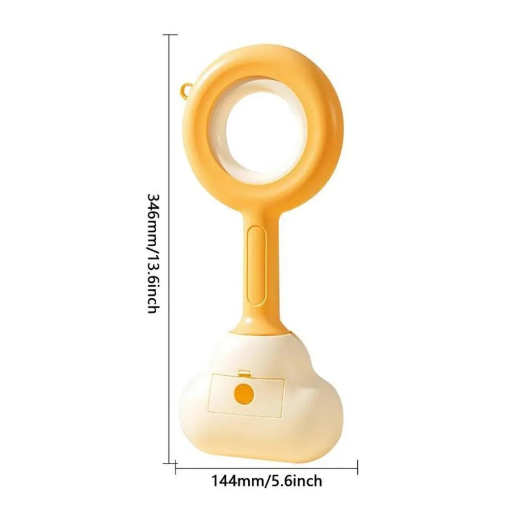 White blue and beige coloured cloud jaw design dog pooper scooper on a green lawn.